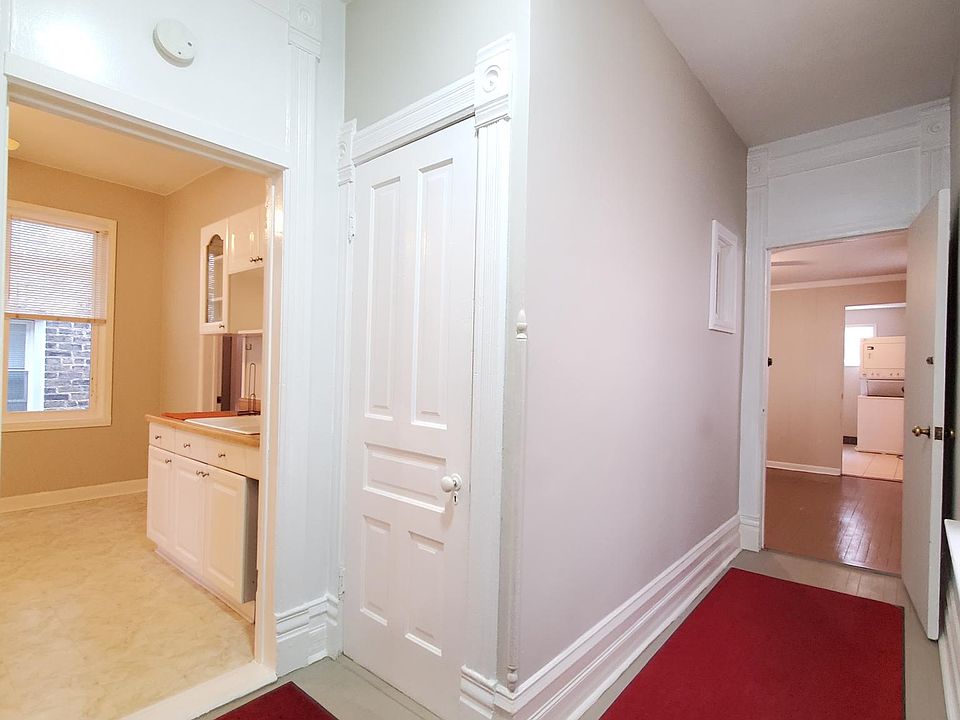 Hallway. Kitchen to the left and Living Room down the hallway
