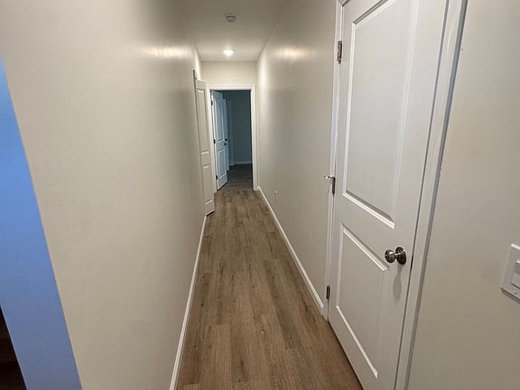 Hallway 1st floor, off Front door & garage go to the Den Area.