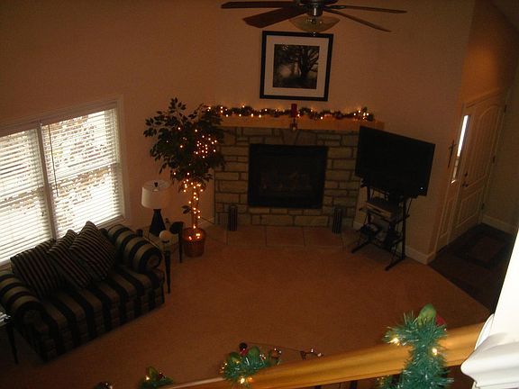 Great room with vaulted ceiling and fireplace.