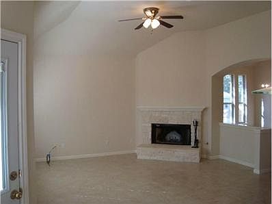 Living Room: High ceilings provide a very open and airy liv