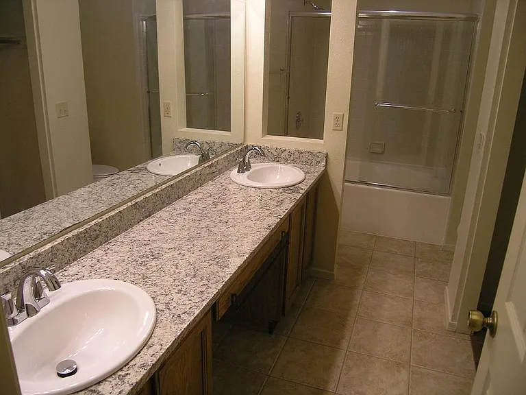 Master bathroom with double sinks and Roman tub