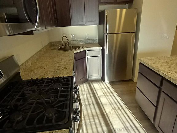 Kitchen with large island and plenty of cabinet/drawer space.