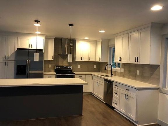 Big open kitchen. New cabinets. New lightning & plumbing.