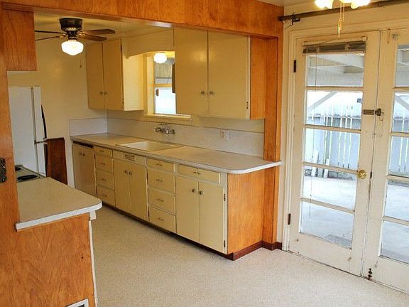 Hardwoods, open kitchen / dining room and fireplace.