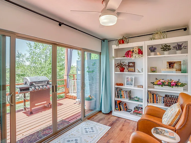 Sunroom with double sliding glass doors to deck