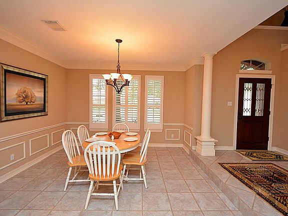 Entry to the home you are greeted by a beautiful foyer with step down dining and family room.