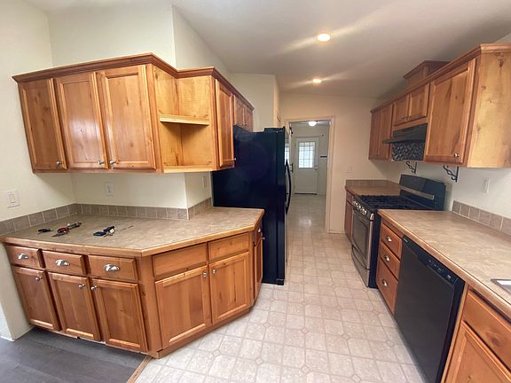 Kitchen, beverage/storage/entertainment space on the left.