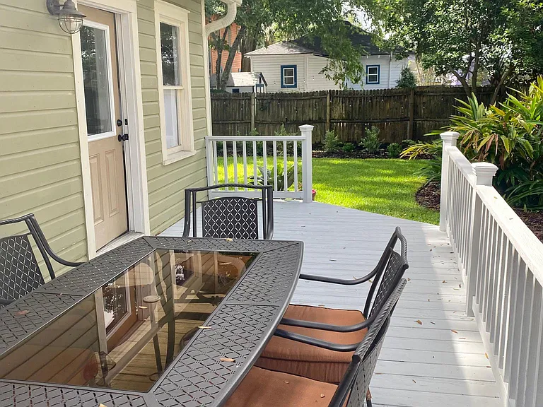 Outdoor dining area with solar bistro lights