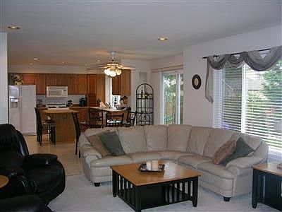 Free flowing family room with fireplace.