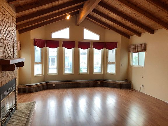 Great room with hardwood floors and wood/gas fireplace.