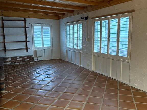 Living room windows and bookcase