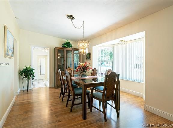 Dining room with impact glass bay window