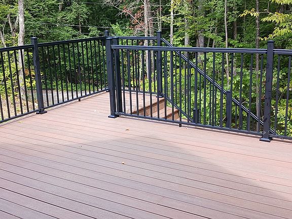 Large private deck overlooking surrounding woods