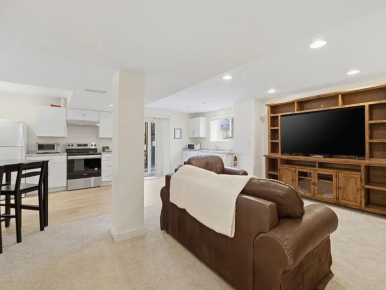 Bright living area with seating and TV
