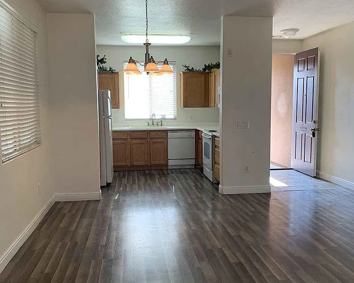view from patio door towards kitchen and front entrance