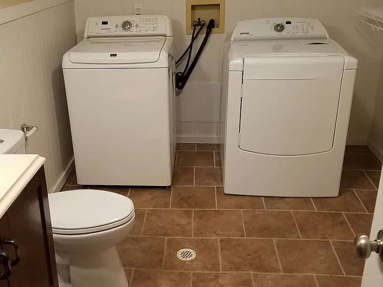 Newer washer and dryer in bathroom/laundry room