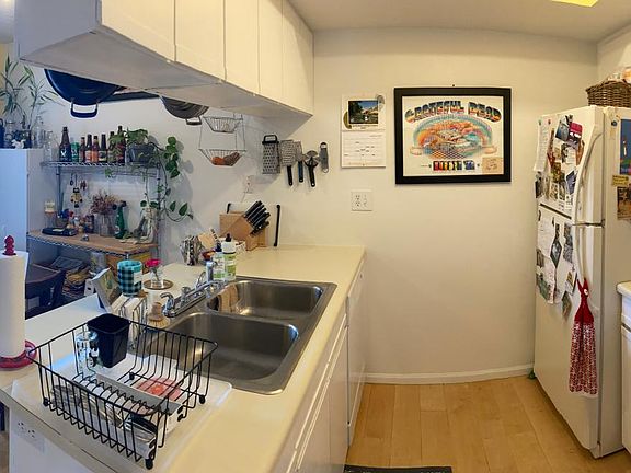 Kitchen, dining area, and main entrance