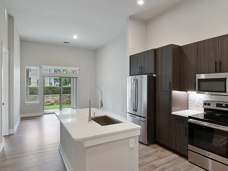 Cook and entertain with ease in a sleek, modern kitchen built for both style and function.