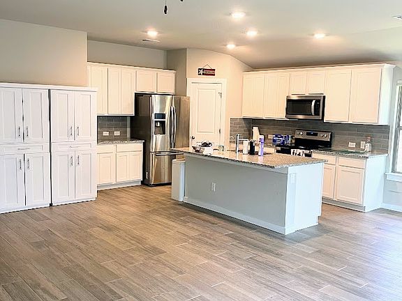 Kitchen with Extra Storage Cabinets, Refrigerator Included, Walk-in Pantry, Granite Countertops, Reverse Osmosis Water Purification System