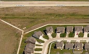 House on outside of corner, center of picture