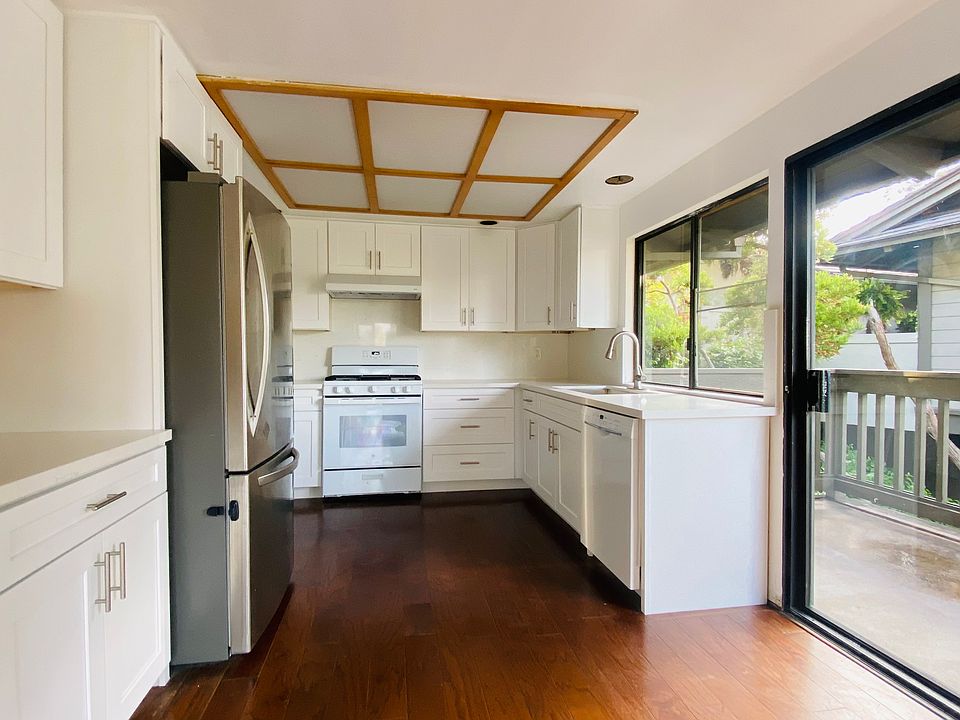 Newly renovated kitchen with brand new cabinets, countertops, and modern appliances.