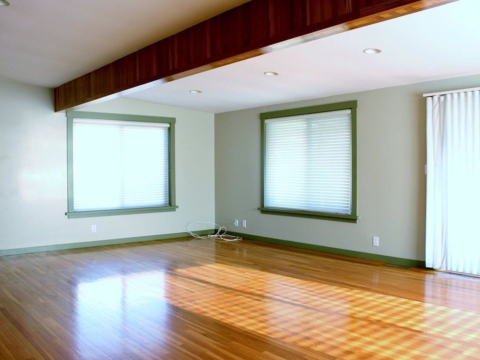 Wood floors throughout living room and bedrooms