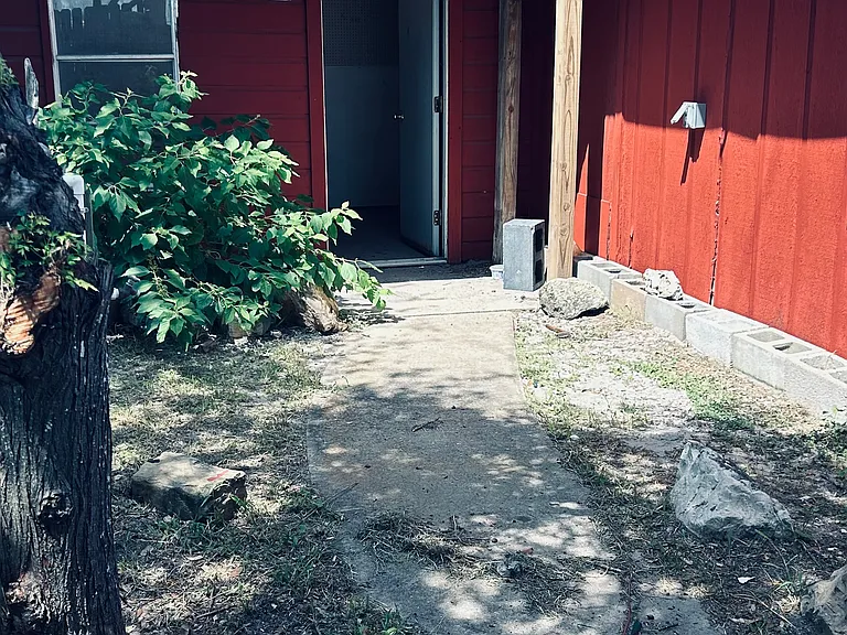 Storage Room in yard behind fence