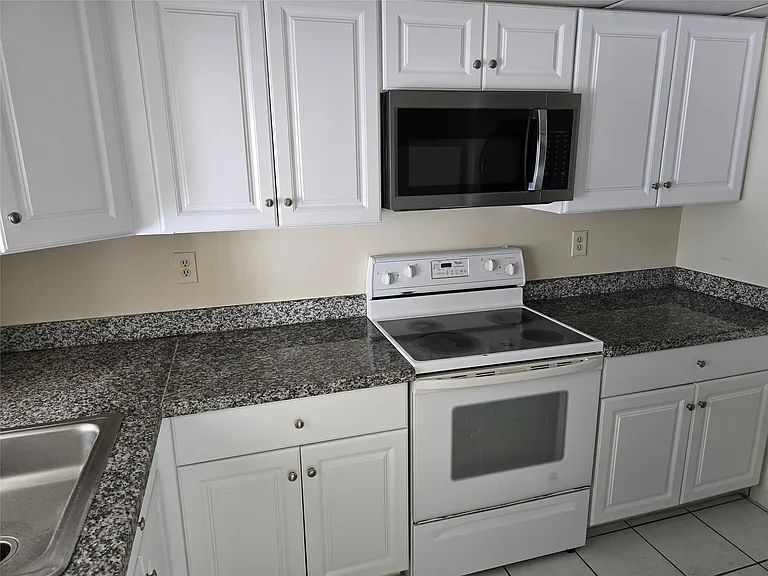 10050 Winding Lake Rd #103 — Photo 2
