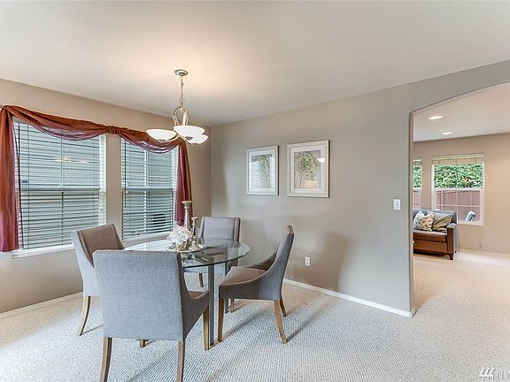 The formal dining area has lots of space for a buffet or sideboard