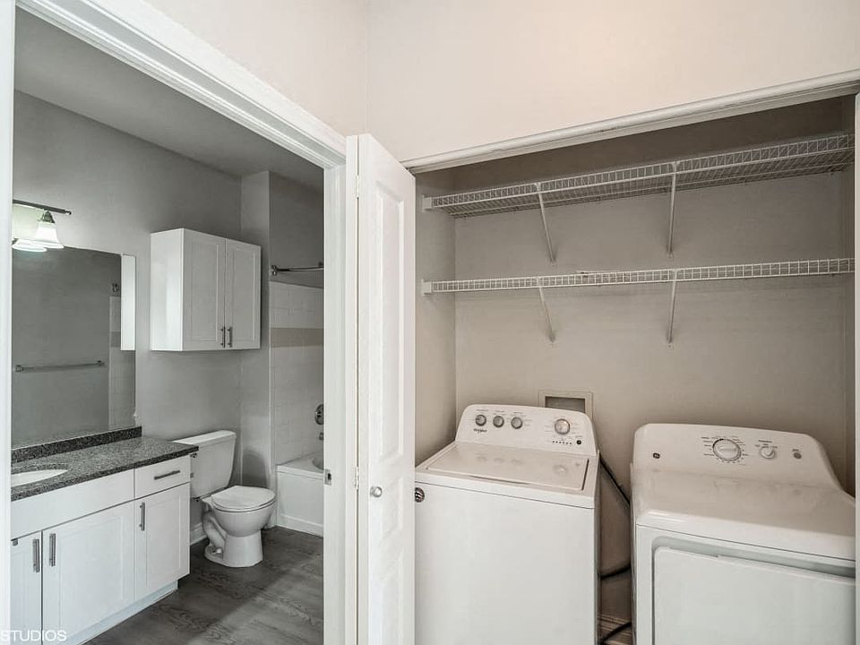 In unit laundry room with washer and dryer