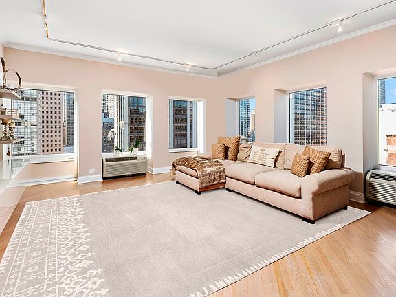 The spacious living room can easily fit a large sectional and is perfect for entertaining.