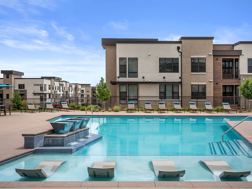 Sparkling Pool with In-Pool Loungers and Relaxing Deck Seating
