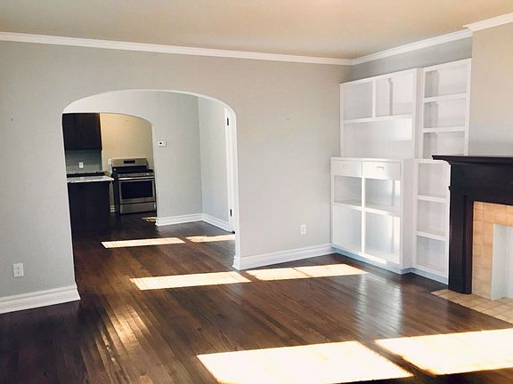 Living room unoccupied, looking toward kitchen