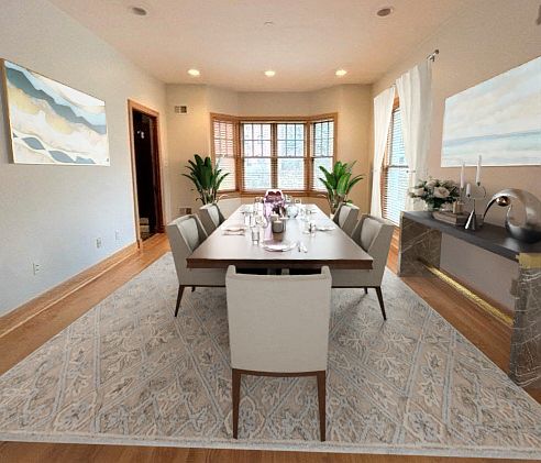 Extra Room with beautiful wood doors. Natural light (Sun rises towards this front room) Home Office, Den, Bedroom, or Dining room!