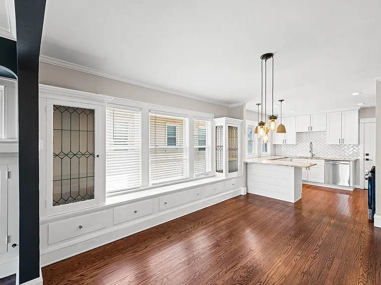 This photo shows the dining room/kitchen from the living room.