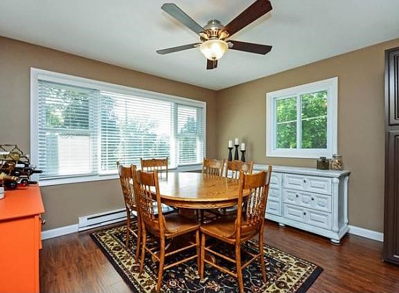 The dining room is flooded with natural light and is conveniently located right off the kitchen.