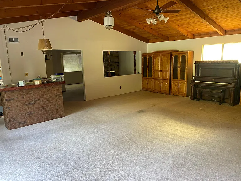 Another view of large family room with wet bar