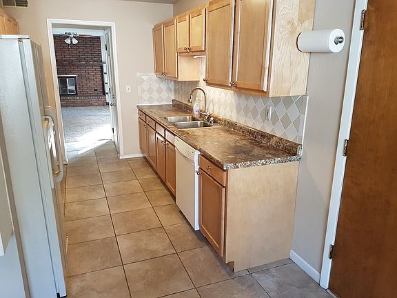 Kitchen looking into living room