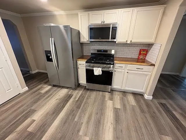 Kitchen appliances included. Gas stove/ oven, MIcrowave, Fridge with plenty of cabinet space.