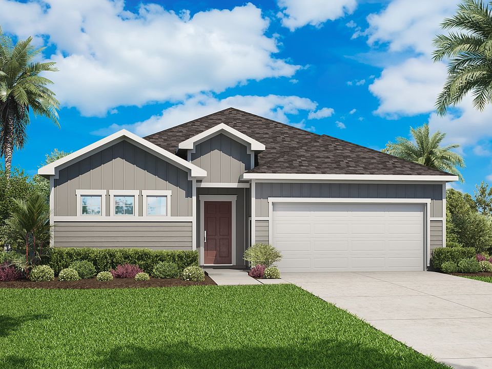 Experience elegant simplicity with a striking gabled roof and pristine landscaping in Palm Coast.