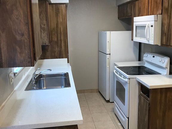 New quartz countertops, LED lighting, sink, garbage disposal, faucet and blinds.