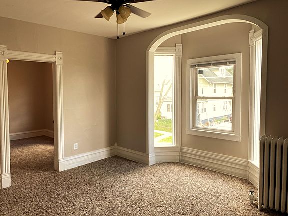Spacious, bright living room with lovely new floors and heaps of streaming natural light!