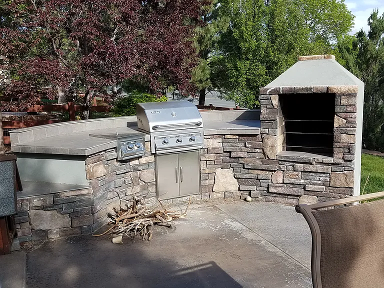 Shared backyard patio space with fountain and grill for your summer enjoyment!