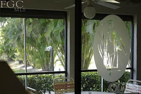 Lanai taken from sliding glass doors closed in living area.