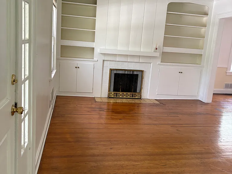 Living room as you walk in the front door. Fireplace is not functional