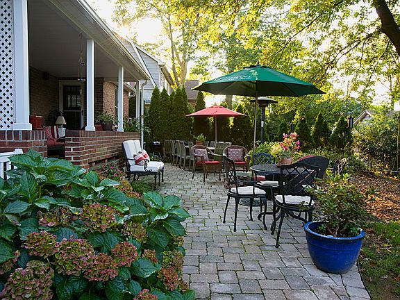 Large tumbled paver patio with fire circle