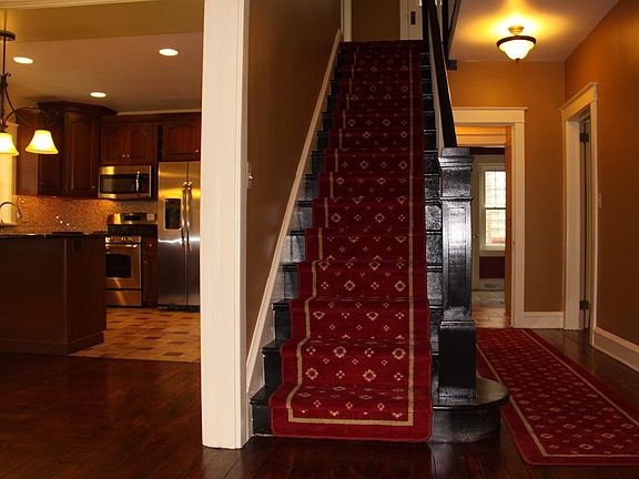 Foyer entrance to upstairs, dining room, kitchen and family room.