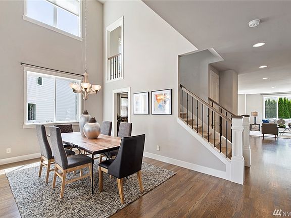 Sparkling hardwood floors flow throughout the formal dining room, family room, and kitchen.