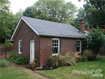 View of garage and gardens.
