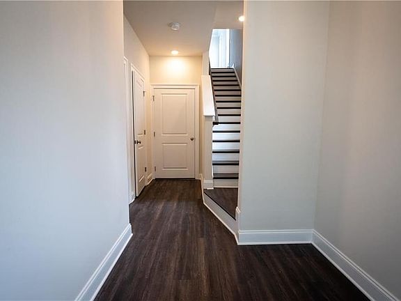 ENTRY FOYER WITH PLENTY OF SPACE FOR A SIDE TABLE FOR KEY-DROP AREA. CONVENIENT COAT CLOSET WHEN ENT